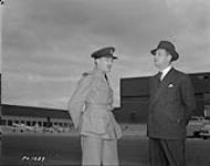 Wing Commander F.S. McGill with visitor at Uplands August 23, 1940