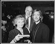 Warner Music Canada's Stan Kulin (centre) and his wife Marie break bread with George Fox at the Four Seasons Hotel [between 1994-2000].
