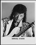 Publicity portrait of Erroll Starr holding a guitar [ca 1986].