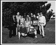 Spirit of the West receiving album awards and posing with Stan Kulin and five unidentified men [ca 1990].