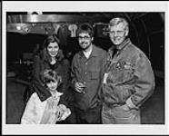 Lisa Zbitnew, her daughter Gillian Zbitnew, and Paul Alofs meeting with Bill Priddle of Treble Charger (centre) after the band's performance at Segacity, Mississauga, Ontario [between 1996-1997].