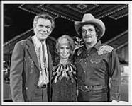 Tommy Hunter with Tammy Wynette and Ed Bruce on the set of CBC's "The Tommy Hunter Show" [ca 1981].