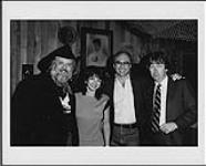 L to r: Ronnie Hawkins, Kip Kirby (Billboard Magazine), Bill Carter (Legal Council), Steve Thomson (President, Backstage Productions International) [entre 1980-1985].