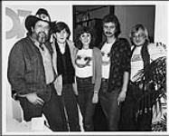 L to r: Ronnie Hawkins, Bobby Gale (Q-107), Bob Mackowycz, Nick Panaseiko (Word Records) [between 1975-1980].