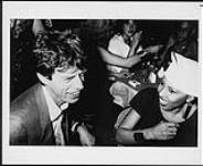 Nona Hendryx and Mick Jagger at a party at the club "Mainsqueeze," London n.d.