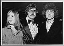 John Pozer and Terry Jacks posing with a friend [between 1970-1977].