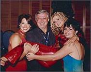 Lace's Beverley Mahood being lifted by her bandmates Giselle and Stacy Lee and Warner Music Canada president Garry Newman at Warner's party following the CCMA Awards show [entre 1998-2000].