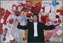 Huey Lewis in front of a Valentine's Day display [between 1990-2000]