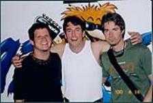 Snapshot of Vancouver's 99.3 radio station announcer Scott Barratt with Brian Desveaux and John Hampson of the band Nine Days. Richards and Richards night club, Vancouver [entre 1990-2000]