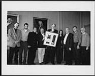 Warner Music Canada's Stan Kulin presented Alanis Morissette with an eight times platinum plaque for her album Jagged Little Pill. Maverick Records president Freddie DeMann then presented Warner Music Canada with an award for eight times platinum in the United States. Pictured left to right: Scott Welsh (manager), Guy Orsery & Freddie DeMann (Maverick), Garry Newman & Stan Kulin (Warner Music Can 10 mars 1996