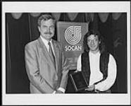Stan Meissner with a SOCAN plaque commemorating the chart-topping success of his song, "Leila." He co-wrote the hit with Quebec-based singer Lara Fabian, her recording of the song reached #1 on Le Palmarès Top 50 Francophone chart during the week of June 12, 1995. This was the second #1 hit for the pair.  On August 28th, Stan was honoured by SOCAN during a well attended gathering at Milano Billia 28 août 1995