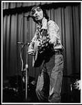 Country singer and songwriter, Roy Payne, singing and playing guitar [between 1975-1985].