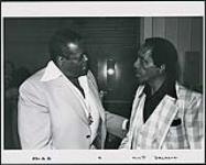 Oscar Peterson conversing with Milt Jackson [between 1975-1978].