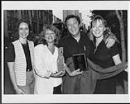 Members of SOCAN present Keith Glass, of Prarie Oyster, with a SOCAN Award [between 1991-1992].