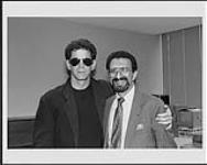 Lou Reed standing with an unidentified man [entre 1984-1986].