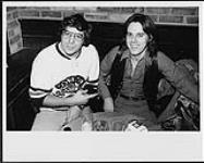Vito (left) from Records on Wheels and Bruce Wheaton (right), member of the band Molly Oliver [between 1976-1979].