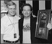 Paul Alofs and Alan Kates, holding an award for Certified Canadian Gold [between 1996-1997].