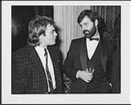 Surrender's lead singer Alfie Zappacosta Talks with EMI President, Rupert Perry, at Capitol's post-Juno Awards party 1 avril 1983