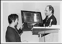 Brian Robertson presenting an award to Sheila Copps April 25, 1997
