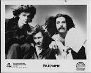 Publicity portrait of Triumph with their hair blown back [entre 1975-1982].