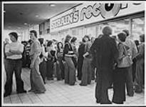 Crowd outside Strain's Records at Polo Park shopping centre, Winnipeg, Manitoba, for a Trooper autograph session [between 1975-1980].