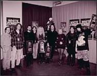 The staff from MCA Music present recording artists White Zombie with Platinum awards for the release of the album Astro Creep [ca 1995].