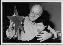 Don Daynard gets a "Star Of Recognition" from Ginny Young of the Famous People Players [between 1995-2000].