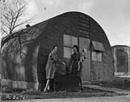 Corp. East and Airwomen Jamieson who are members of the R.C.A.F. Women's Division with the Canadian Bomber Group headquarters in England N.D.