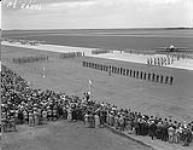 General view of opening ceremony at No. 17 S.F.T.S. Souris, Manitoba. G/C R.S. Grandy, station , pins wing on student 23 June 1943.