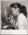 "Delphine Arcand, Laboratory Technician & Aide at Camsell Hospital, Edmonton" August 1954.
