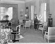The Drawing Room at 24 Sussex Drive, official residence of Canadian Prime Ministers. Walls and silk damask hangings are grey-green. Four large windows on one wall look out over the OttawaRiver to the Gatineau Hills Apr. 1951