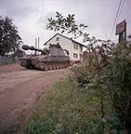 Ex Reforger. Germany. An M-109 155mm self-propelled howitzer of 1 RCHA moves past a German house during Ex Reforger 74 in Bavaria October 1974.