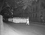 Sunset Ceremony. Naval Gun carriage crew marching down Wellington Street, Ottawa towards Parliament Hill 1 July 1959.