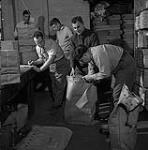 Preparing election materials at the Chief Electoral Office for mailing across Canada mai 1952