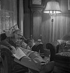 Dr. Rivard relaxing at home with his dog 1954