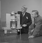 Dr. David A. Keys and Gordon Hatfield examining a reactor 1955