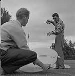 Glen Holm, left, Jack Barnes, with model saucer 1955