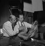 Karsh and a co-worker in a photo laboratory 1957