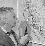 Dr. J. P. Tully locating the Hecate model area 1959