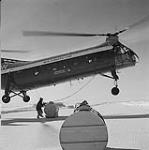 Food supplies delivered by a helicopter to a remote location 1959
