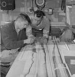 Left is Michael Lewis, a geology student at University of and Dave keen who is a Toronto based technician 1961