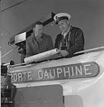 Captain Archie A. Hodge, right, and Professor Roger E. Deane, left, the director of research 1961