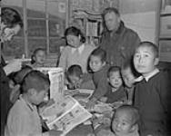 Canadian Army Chaplain Major John M. Anderson visiting Pusan orphans in Korea 31 January 1954.