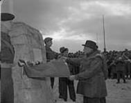 Prime Minister St. Laurent unveils monument at Maple Leaf Park in Korea March 1954.