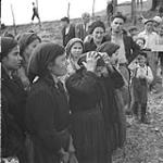 Women weeping. Three bereaved women weeping on spot where 16 civilians were slain by Germans in Rionero September 1943.