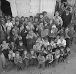 Civilians and kids cheering first Canadian troops in Rionero September 1943.