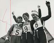 Nancy Greene (center), winner of gold medal; Annie Famose (left), winner of silver medal and Ferande Bochatay, winner of bronze medal, following giant slalom competition at the 1968 Winter Olympics 15 February, 1968