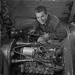 Stock Car Story. Hot rodders have formed clubs in many provinces of Canada. The one around Winnipeg, Man., is very active and has a track of its own where race and test meetings are held. Here a member is studying the engine of his car September 1959.