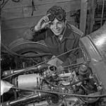 Stock Car Story. Hot rodders have formed clubs in many provinces of Canada. The one around Winnipeg, Man., is very active and has a track of its own where race and test meetings are held. Here a member is studying the engine of his car September 1959.