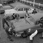 Stock Car Story. One way to raise money for the club is to operate a car wash. All members of the Winnipeg Roadsters Club turn out for this task which allows them to make enough money to meet club's expenses September 1959.